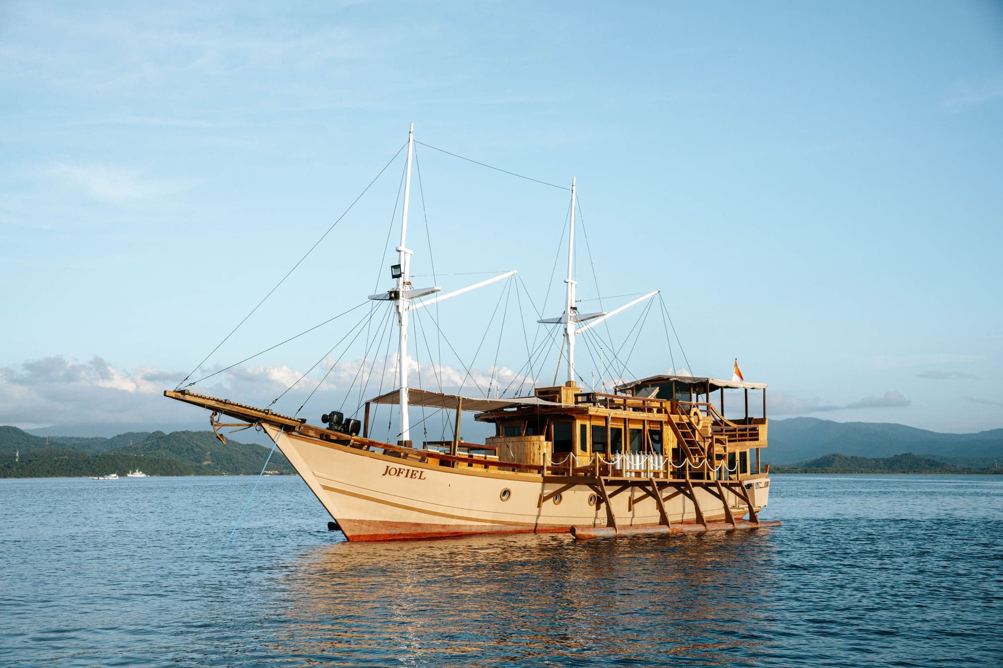 The traditional ironwood phinisi Jofiel seen whole on the water