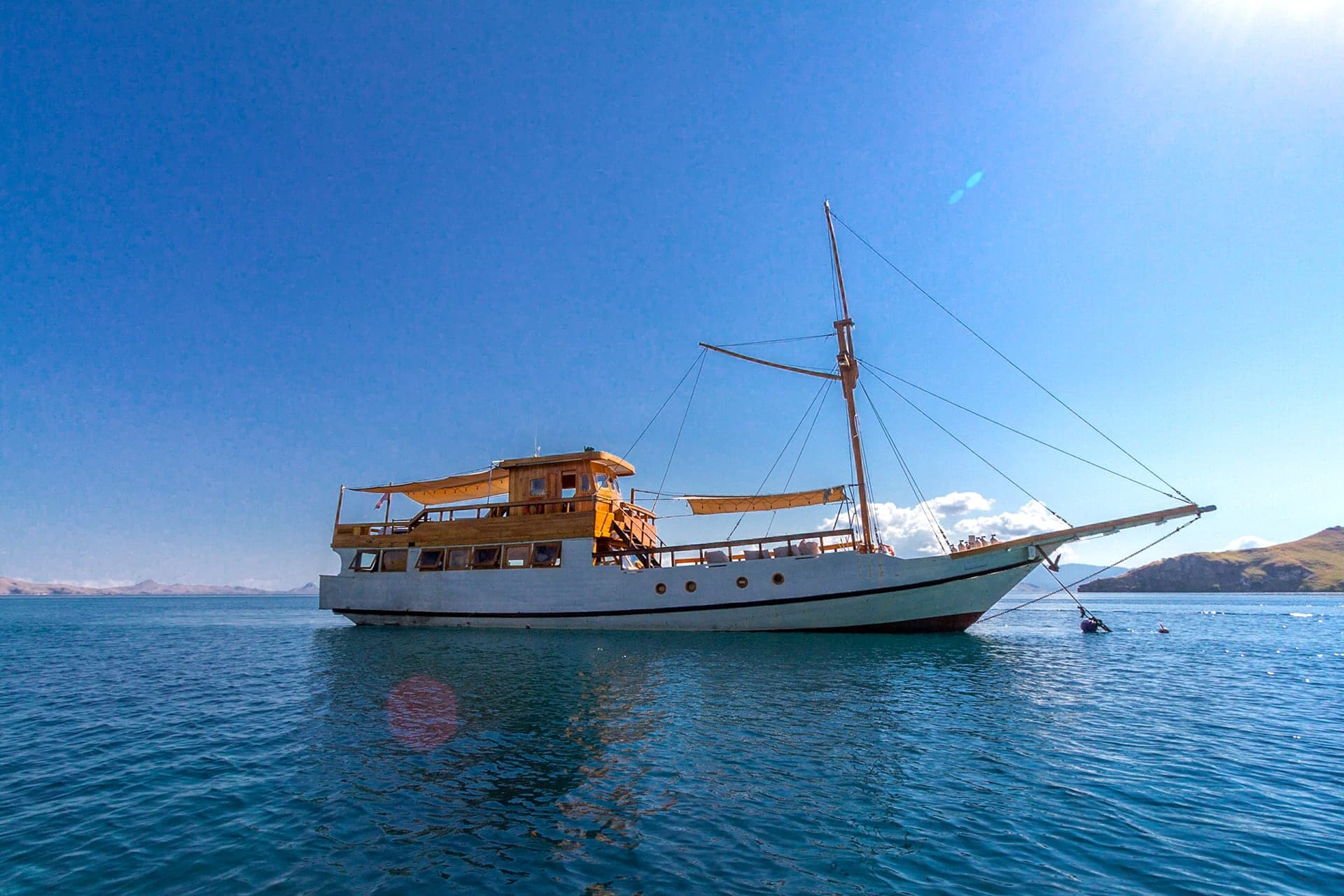The liveaboard Kelana anchored off an island in Komodo National Park