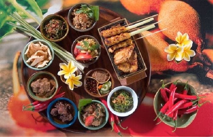 Cooking class in progress in a traditional Balinese home kitchen